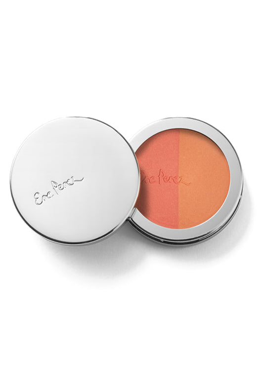 A compact pan with two shades of rice powder blush, one matte and one with pink glimmer, in a white case with a mirror.